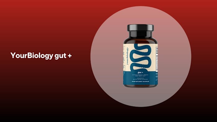 A brown bottle with a tan and white label of YourBiology gut+ probiotics